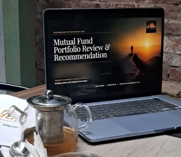 A Radiant portfolio review open on a laptop at a café table, beside a pot of tea